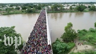 Central Americans in caravan cross into Mexico from Guatemala